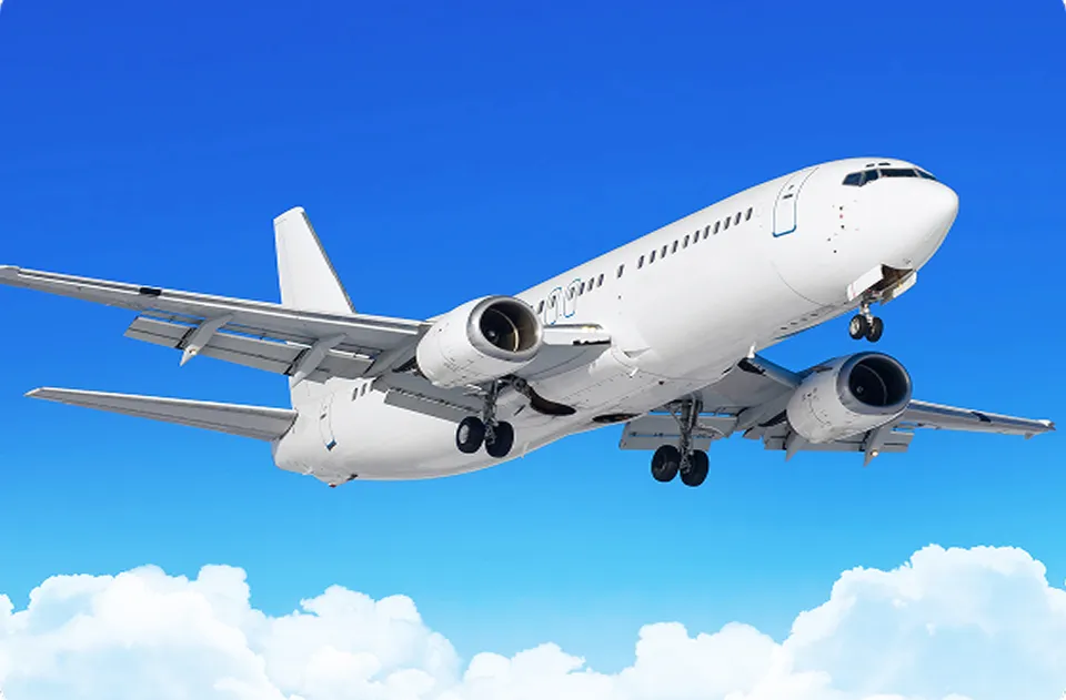 Commercial airplane taking off with blue sky background